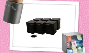 Graue Tee Aufbewahrung Dose mit Holzdeckel, sechs schwarze Tee Dosen und ein Organizer für Teebeutel.